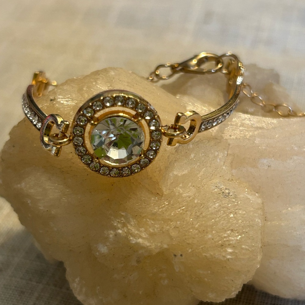 Gold and cubic zirconia focal stone with smaller cz’s each side. - Picture 8 of 9